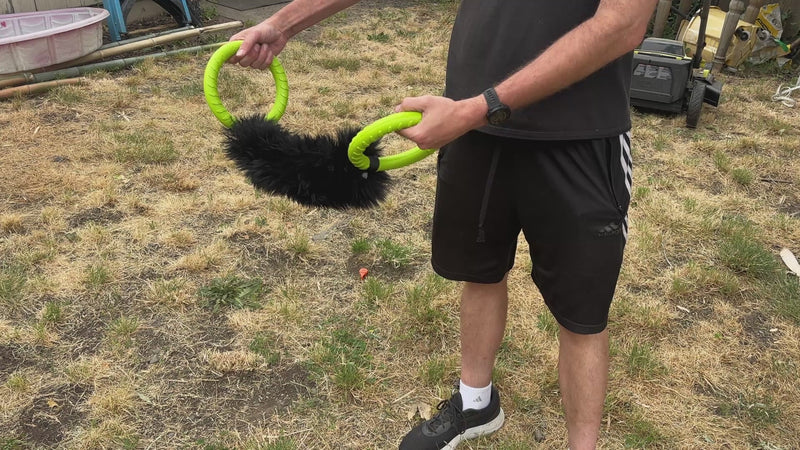 Load and play video in Gallery viewer, Ultimate Sheepskin Tug &amp; Fetch Toy with Dual EVA Foam Ring Handles - Black Fur
